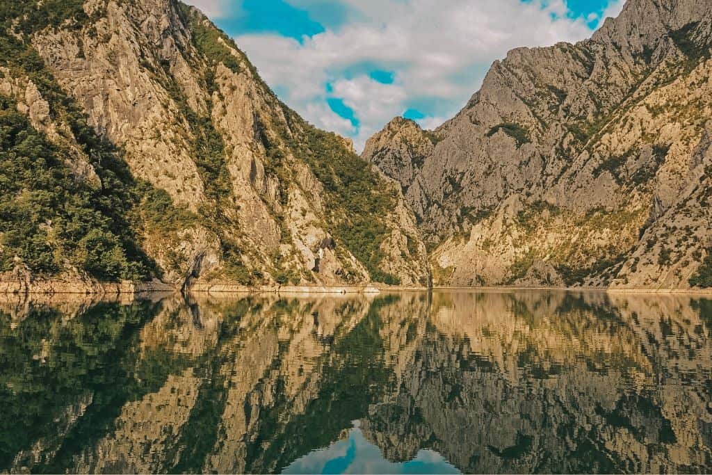 Lake Komani is one of the most stunning places to visit in the Alps