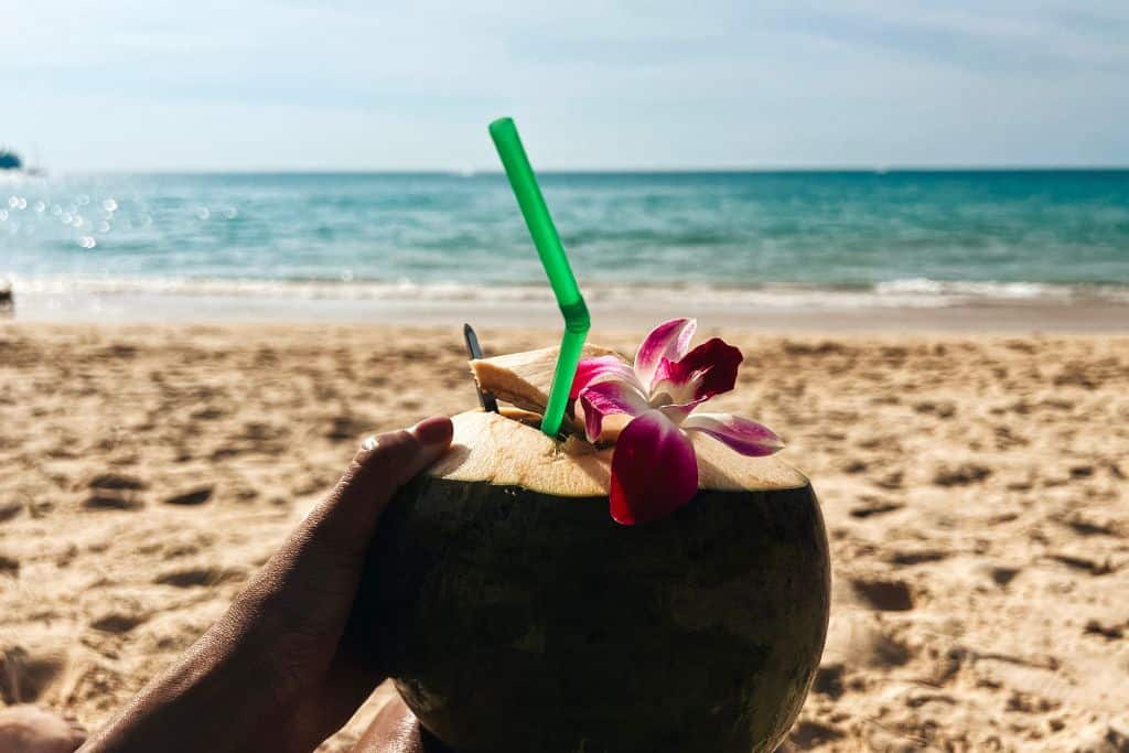 Enjoying coconut water on Phuket beaches is paradise!