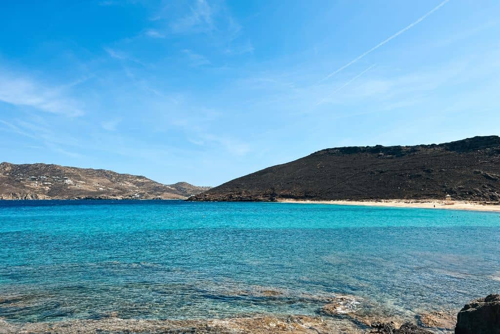 Visiting the beach is a great alternative to beach clubs for saving money in Mykonos.